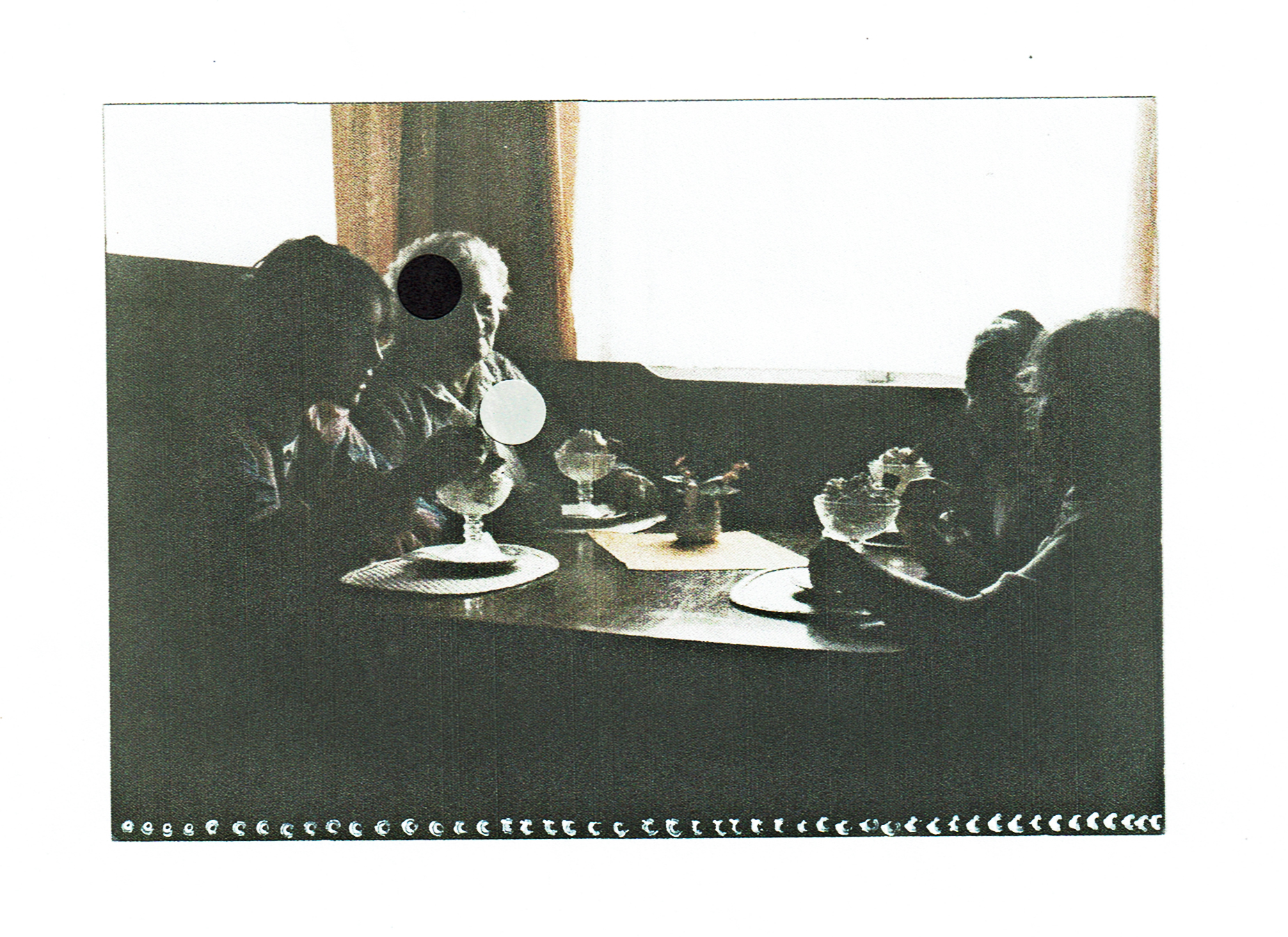 a photo of a family at a table is decorated with paper dots.